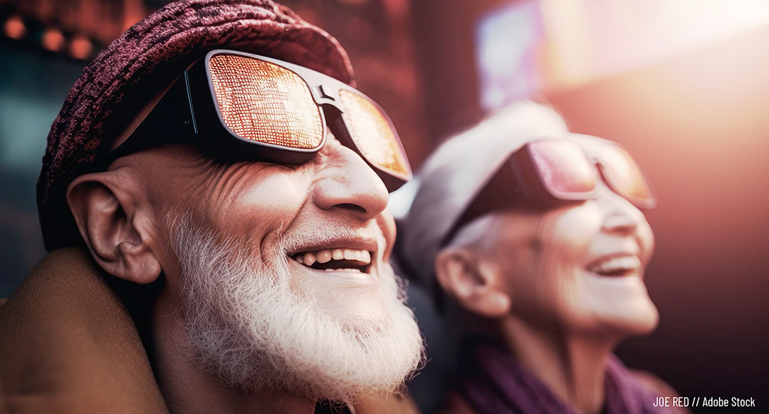 Older couple wearing protective goggles, grinning in awe and delight as they gaze upward at some unseen spectacular display of creative power and beauty